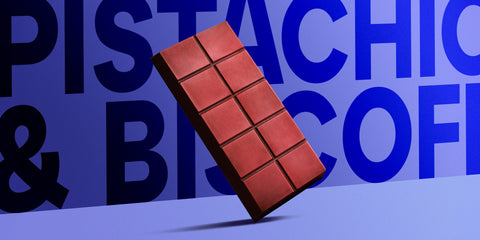 Chocolate bar with 'Pistachio & Biscotti' text on a blue background